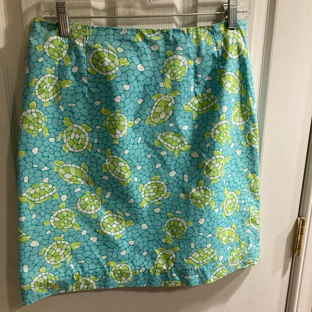 Lilly Y2K skirt w/ turtles.  Zip back with pocket.  Blue green Cotton, lined.